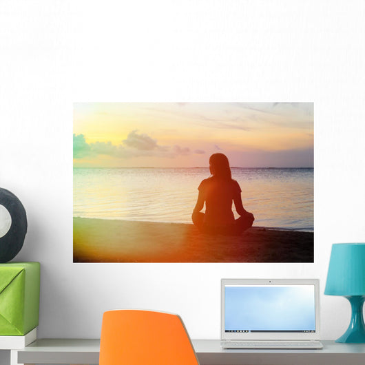 woman meditation on the beach Wall Mural