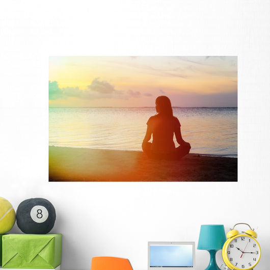 woman meditation on the beach Wall Mural