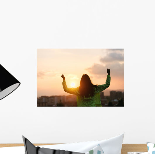 Blissful woman celebrating sport and fitness lifestyle success Wall Mural