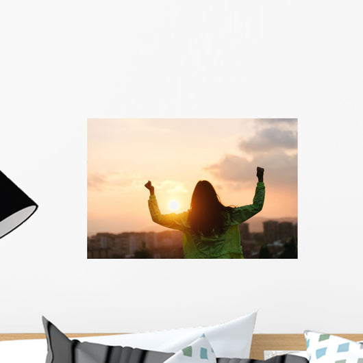 Blissful woman celebrating sport and fitness lifestyle success Wall Mural