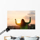 Blissful woman celebrating sport and fitness lifestyle success Wall Mural
