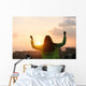 Blissful woman celebrating sport and fitness lifestyle success Wall Mural
