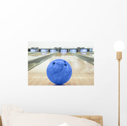 Balls on bowling alley against ten pins Wall Mural