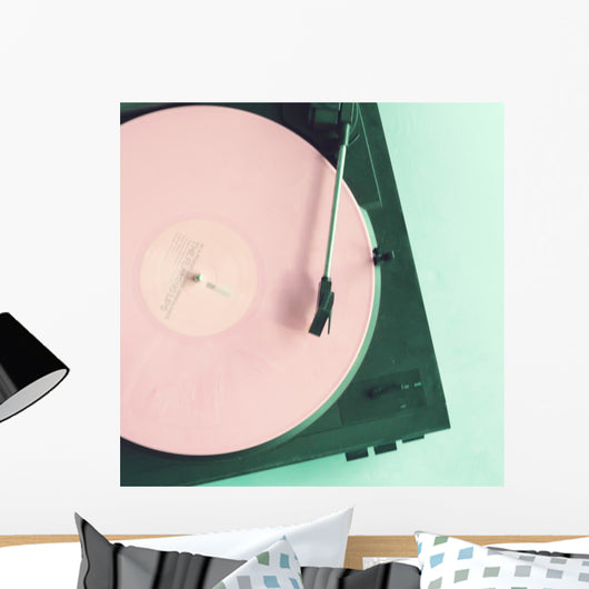 Vintage turntable with pink vinyl record Wall Mural