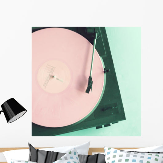 Vintage turntable with pink vinyl record Wall Mural