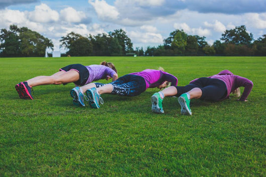 Three Women Doing Push Ups In Park Wall Decal