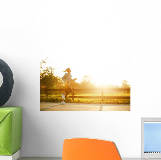 Jogging woman running in park  Wall Mural