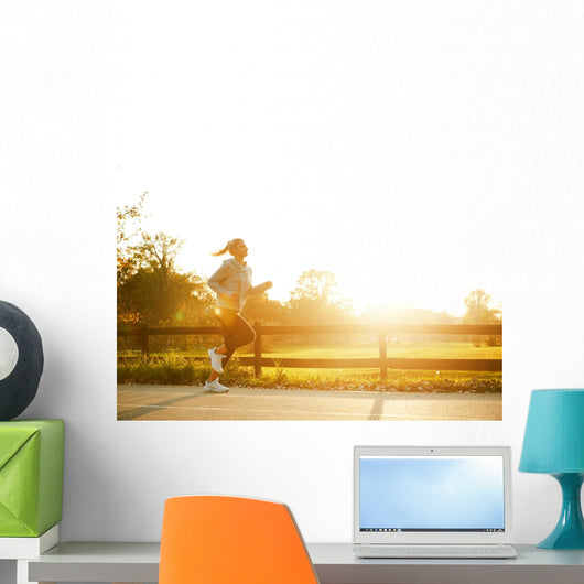 Jogging woman running in park  Wall Mural