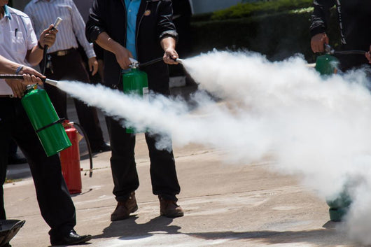 Instructor Showing How To Use A Fire Extinguisher On A Training Wall Decal