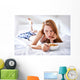 woman in bed eating chicken noodle soup while sick Wall Mural
