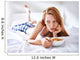 woman in bed eating chicken noodle soup while sick Wall Mural