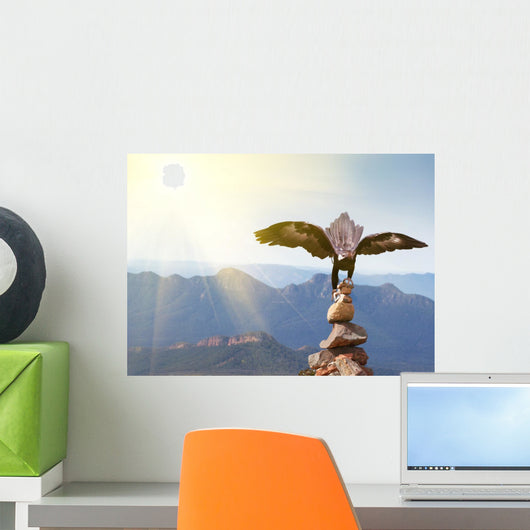 Wedge-tailed Eagle landing on rock cairn on mountain top Wall Mural