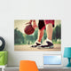 Young man on basketball court dribbling with bal Wall Mural
