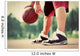 Young man on basketball court dribbling with bal Wall Mural