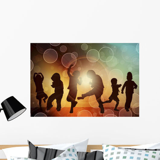 Dancing children silhouettes Wall Mural