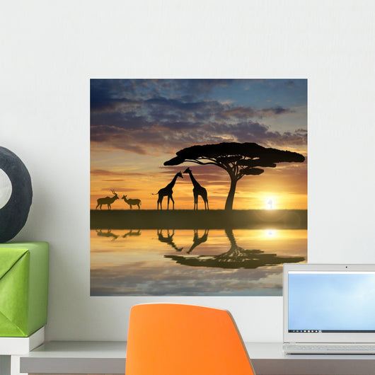 Giraffes with Kudu at sunset Wall Mural