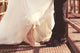 Bride and groom legs on a bridge Wall Mural