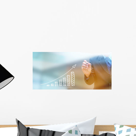 businessman hand writing a business graph on a touch screen inte Wall Mural