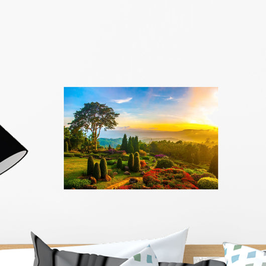 Beautiful garden of colorful flowers on hill with sunrise in the Wall Mural