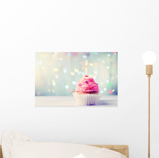 Delicious birthday cupcake on wooden table Wall Mural