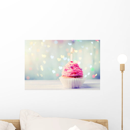 Delicious birthday cupcake on wooden table Wall Mural