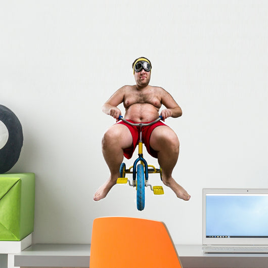 Man riding a small bicycle Wall Decal