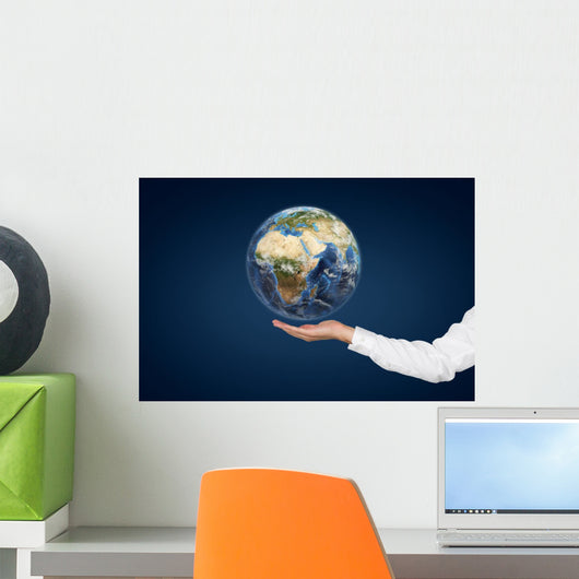 Hand holding Planet. Wall Mural