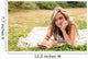 Romantic girl writing in a diary lying down outdoors Wall Mural