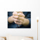 man prays with a rosary in hands Wall Decal