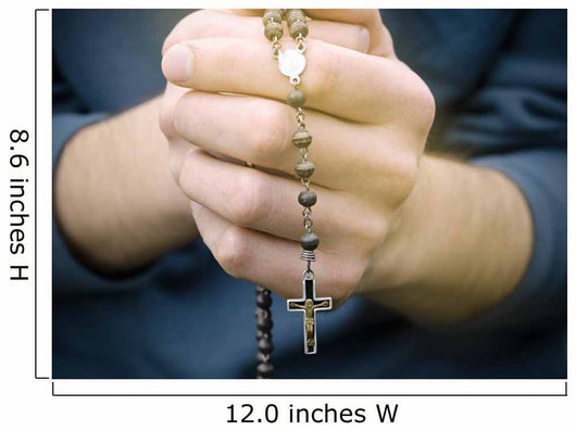 man prays with a rosary in hands Wall Decal