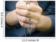 man prays with a rosary in hands Wall Decal
