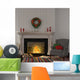 Vintage gray armchair near the fireplace with Christmas decor Wall Decal