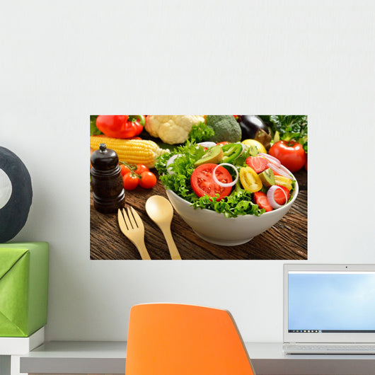 Fruit and vegetable salad in a bowl on wooden table Wall Decal