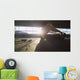 Hooded athlete stretching before or after a workout Wall Decal