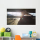 Hooded athlete stretching before or after a workout Wall Decal