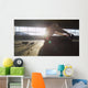 Hooded athlete stretching before or after a workout Wall Decal