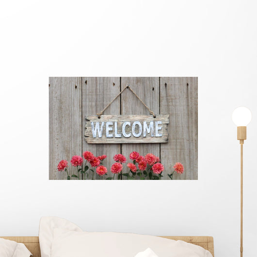 Welcome sign with row of mums by wood fence Wall Decal