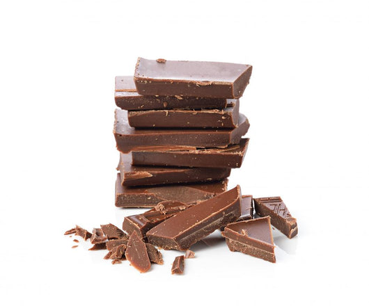 Broken chocolate bar on a white background Wall Decal