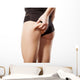woman checking her bottom with pinching Wall Decal