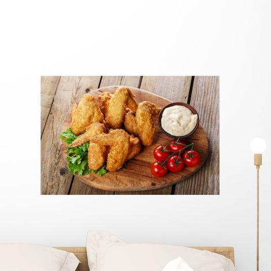 Fried chicken wings with sauce and tomatoes Wall Decal