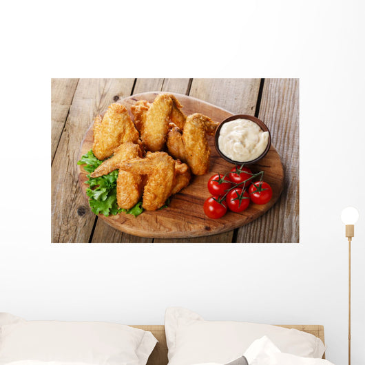 Fried chicken wings with sauce and tomatoes Wall Decal