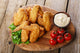 Fried chicken wings with sauce and tomatoes Wall Decal