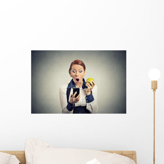 shocked business woman looking at phone seeing bad news Wall Decal