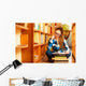Woman student in college library Wall Decal