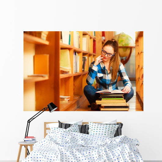 Woman student in college library Wall Decal