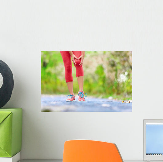 Knee Injury - sports running knee injuries on woman Wall Decal