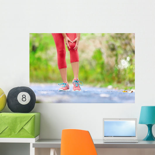 Knee Injury - sports running knee injuries on woman Wall Decal