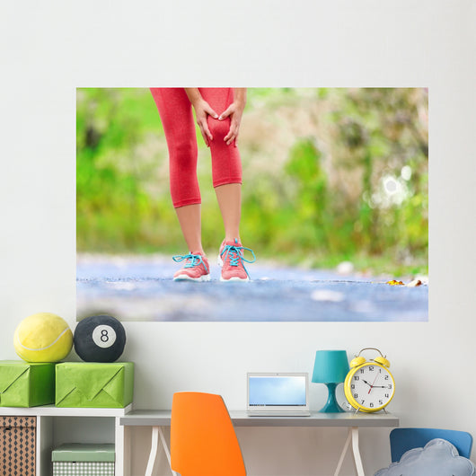 Knee Injury - sports running knee injuries on woman Wall Decal