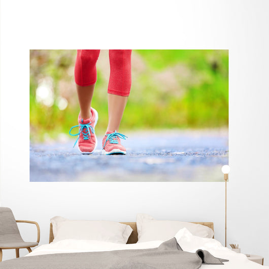 Jogging woman with athletic legs and running shoes Wall Decal