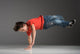 little break dancer showing his skills on grey background. Wall Decal